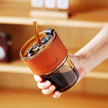 Clear glass sipper bottle with straw and lid
